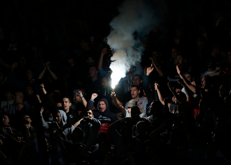 Illustration for article titled Smoke, Flares, Riot Police In Belgrade Derby Make For Haunting Photos